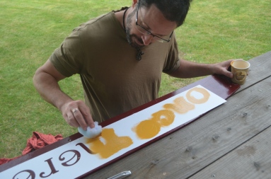 Tom stenciling the crownboard lettering